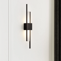 Xeres LED wall light in black installed on a wall