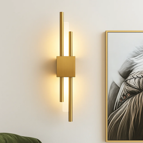 Xeres LED wall light in gold installed on a wall